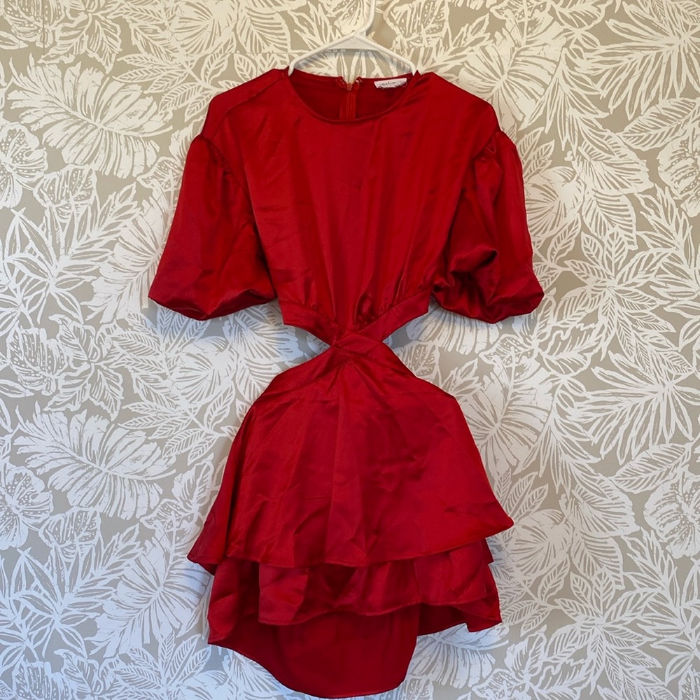 Red mini dress with cut out and puffy sleeves.